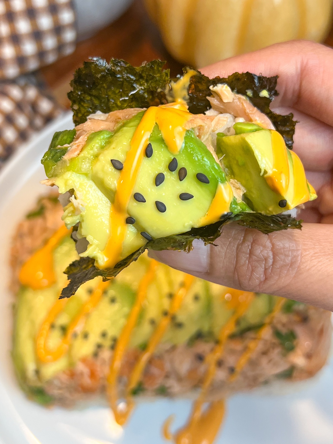 Korean tuna stack with avocado, sushi rice, spicy mayo, Sriracha and roasted seaweed