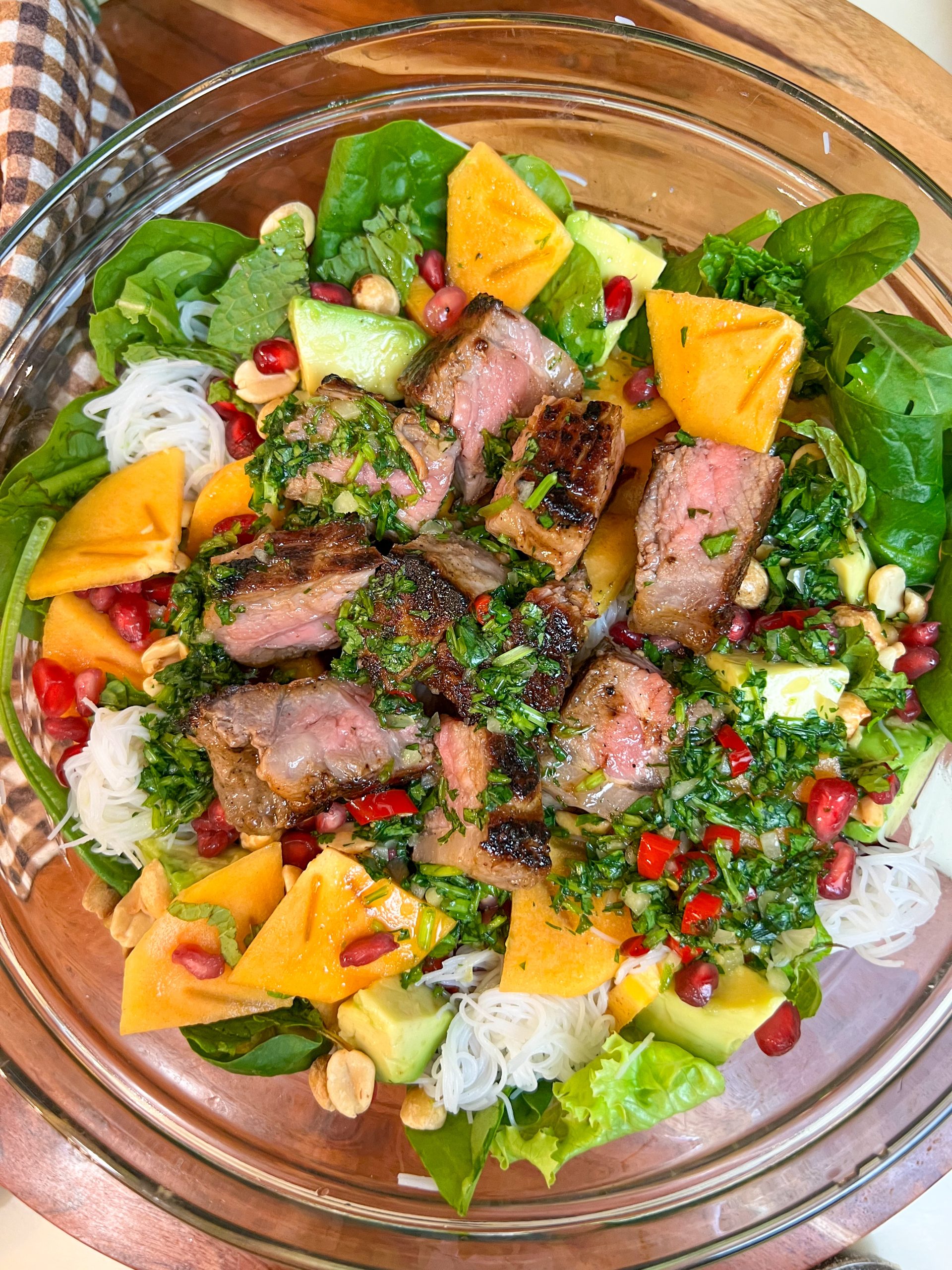 Steak and vermicelli salad with persimmon and pomegranate